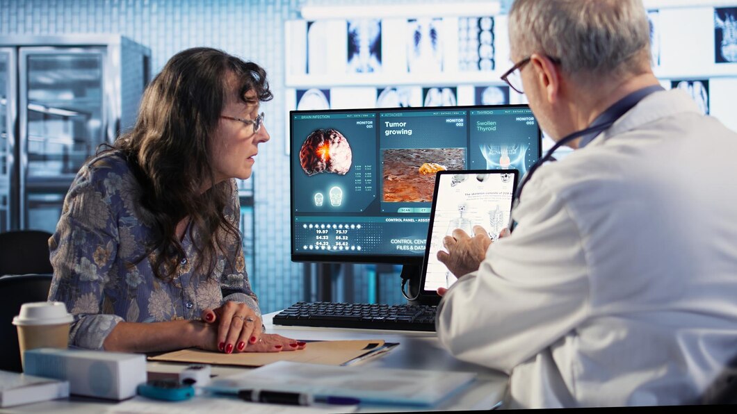 Healthcare professional explaining medical scan results to a patient