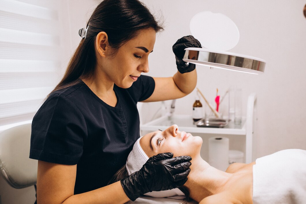 Beauty professional performing a skin care procedure in a salon