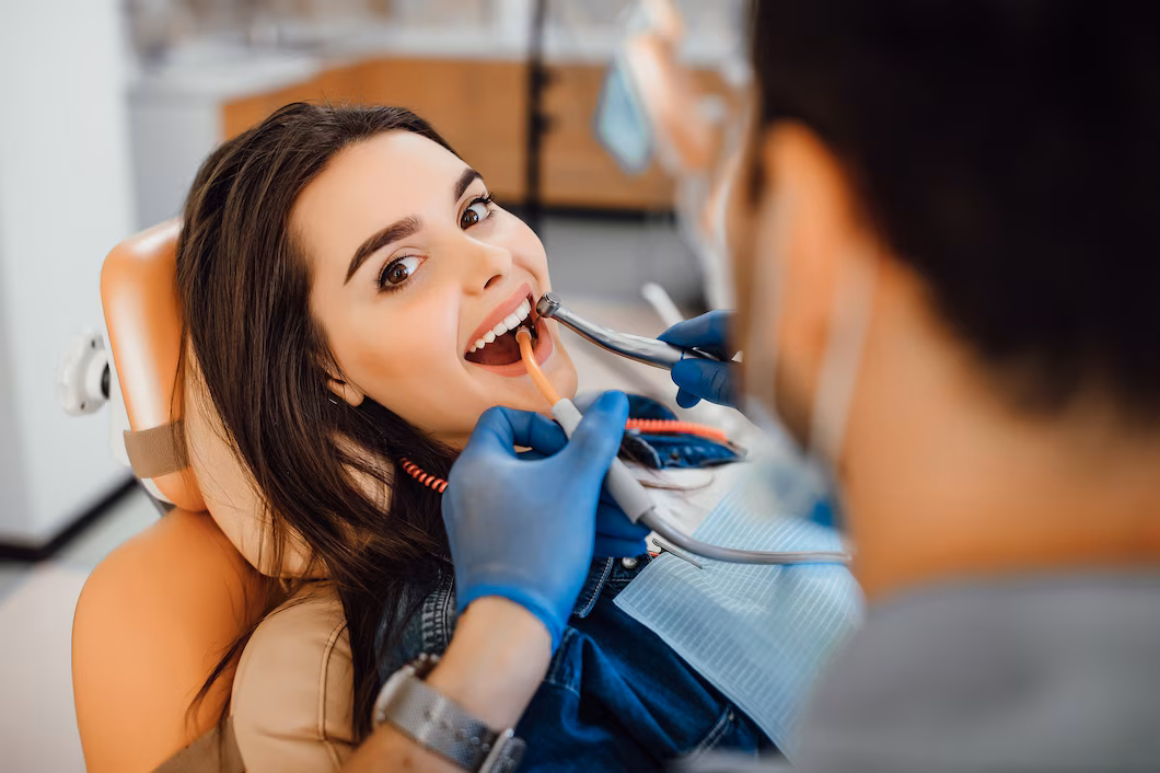 Young female patient visiting a dentist in a modern dental office